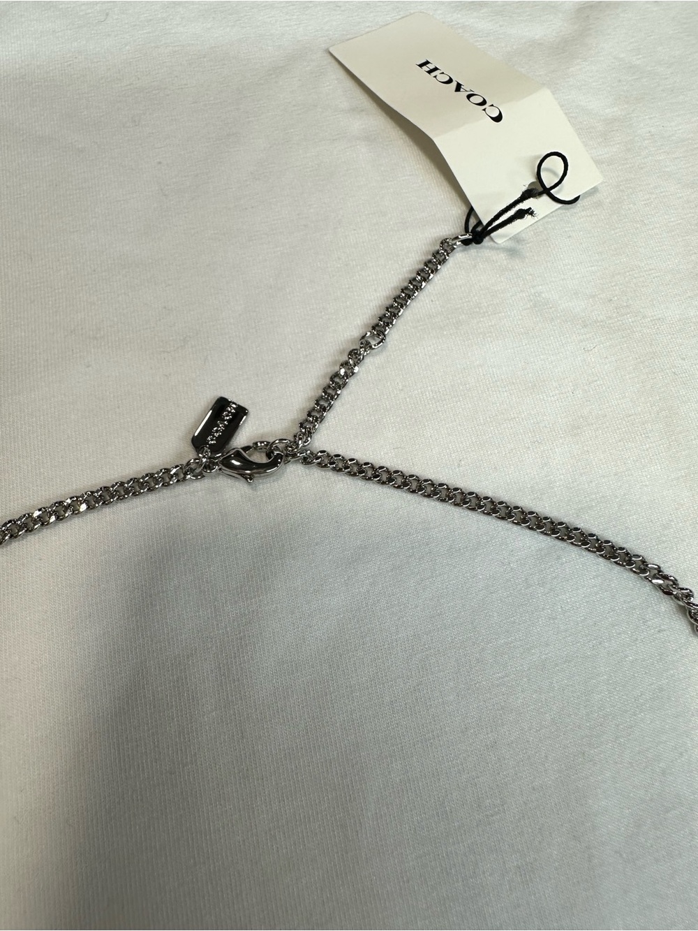 COACH
Two-Tone Signature Carabiner Rexy Pendant Necklace. New with tag . - Picture 8 of 8